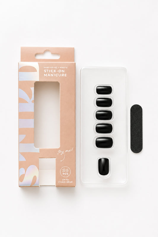 Black Tulip black press-on nails by STIKD, box opened with nail tray and mini file