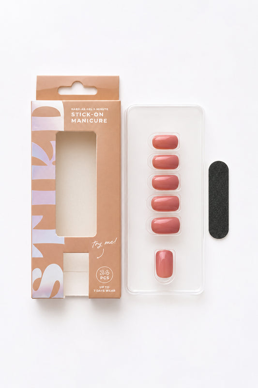 Mauve Orchid mauve pink press-on nails by STIKD, box opened with nail tray and mini file