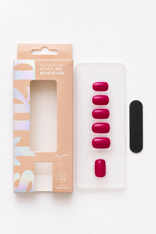 Bougainvillea berry pink press-on nails by STIKD, box opened with nail tray and mini file