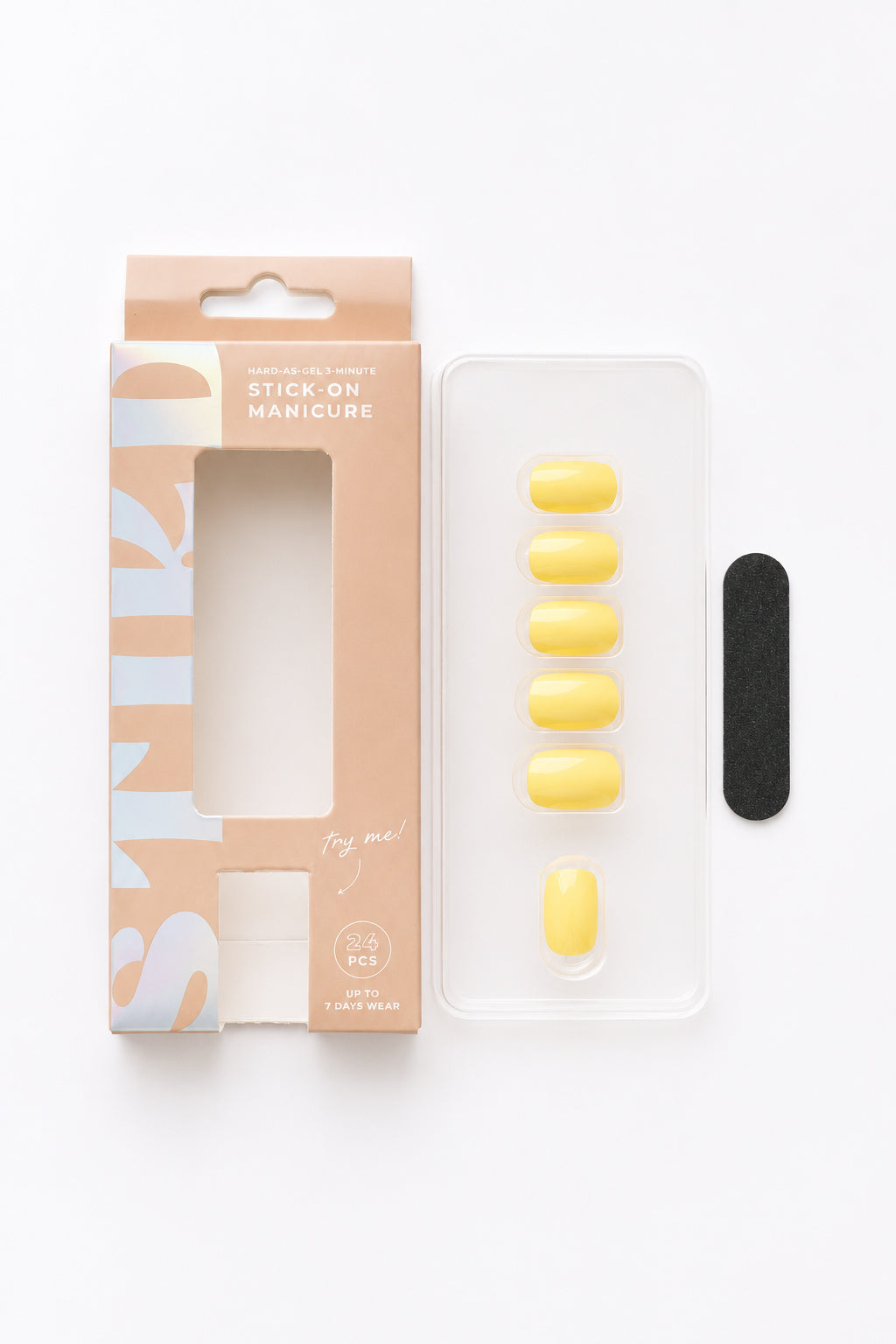 Buttercup pastel yellow press-on nails by STIKD, box opened with nail tray and mini file