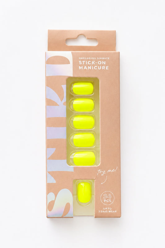 Citron neon yellow short press-on nails by STIKD in retail box