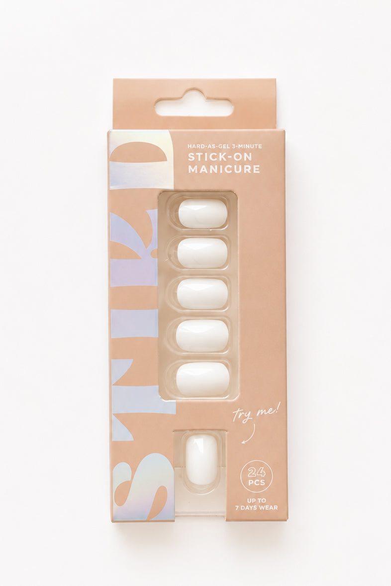 Magnolia white short press-on nails by STIKD in retail box