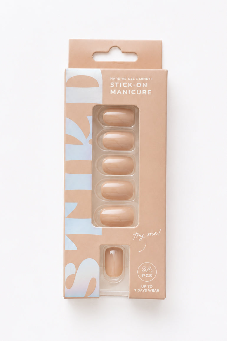 Mushroom taupe nude short press-on nails by STIKD in retail box