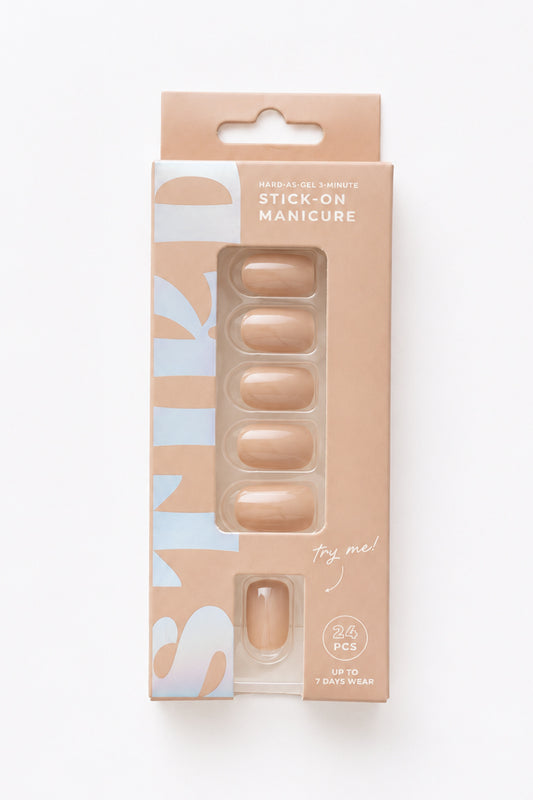 Mushroom taupe nude short press-on nails by STIKD in retail box