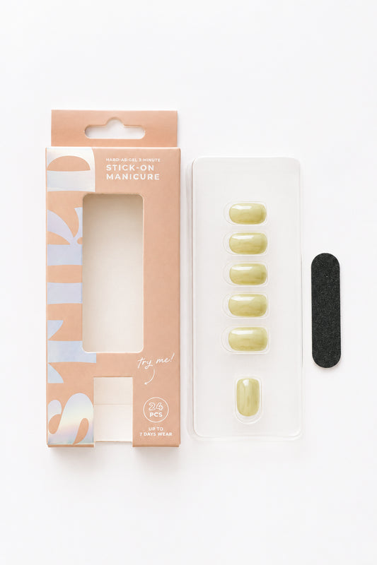 Olive Leaf olive green press-on nails by STIKD, box opened with nail tray and mini file