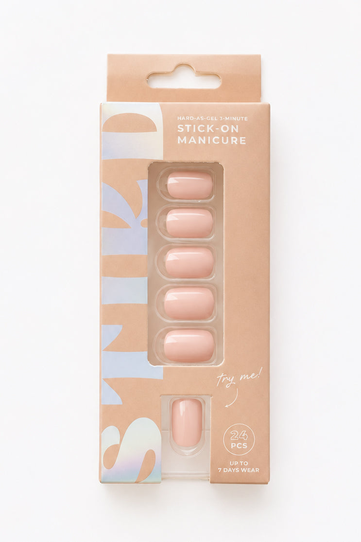 Peony pale pink short press-on nails by STIKD in retail box