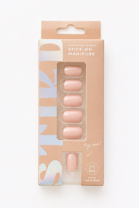 Peony pale pink short press-on nails by STIKD in retail box