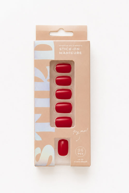 Poppy deep red short press-on nails by STIKD in retail box